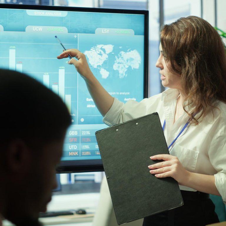 business-associates-reviewing-key-performance-indicators-within-enterprise (1)